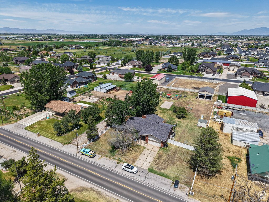 Aerial perspective of suburban area featuring a mountain backdrop