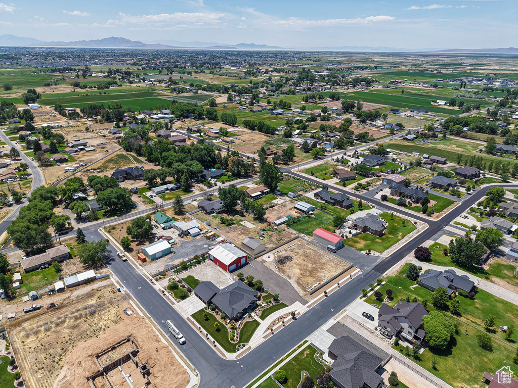 Aerial overview of property\'s location with a mountainous background and nearby suburban area