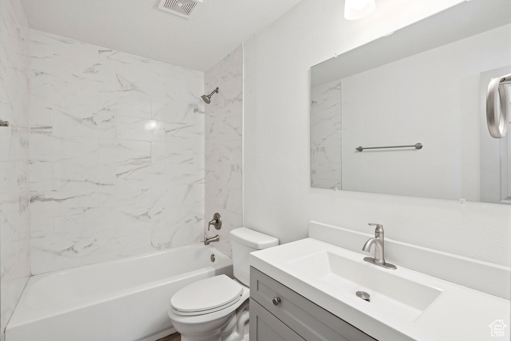 Full bath with vanity and bathtub / shower combination