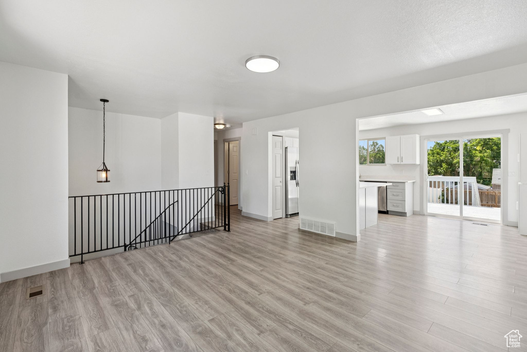Empty room featuring light wood-style floors