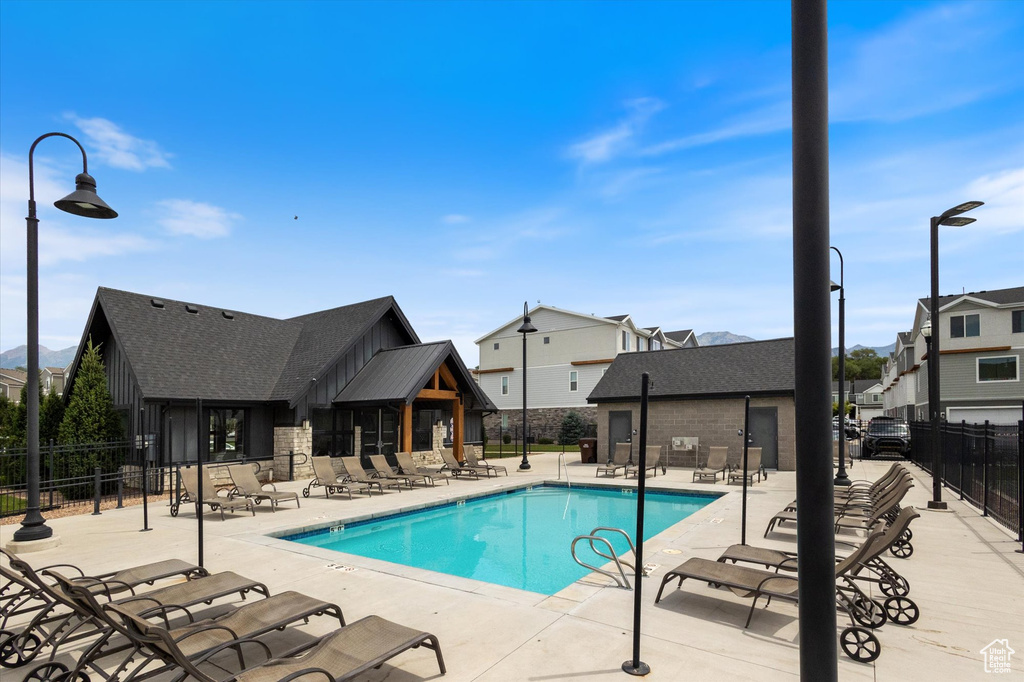 Community pool featuring a patio area