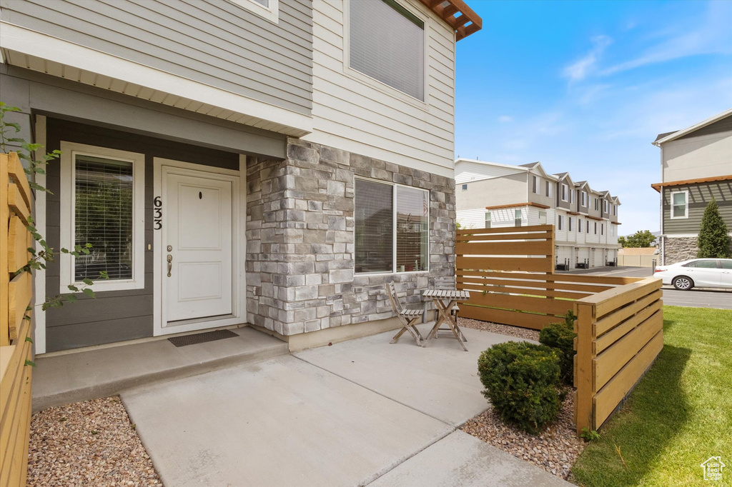 Property entrance featuring stone siding