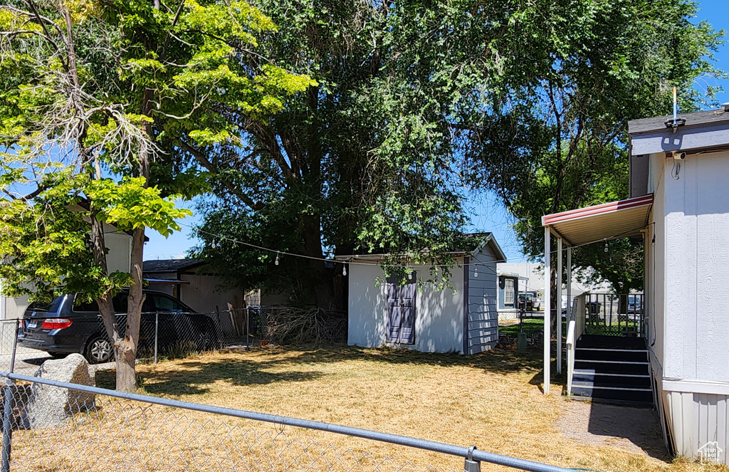 Fenced yard with a storage shed