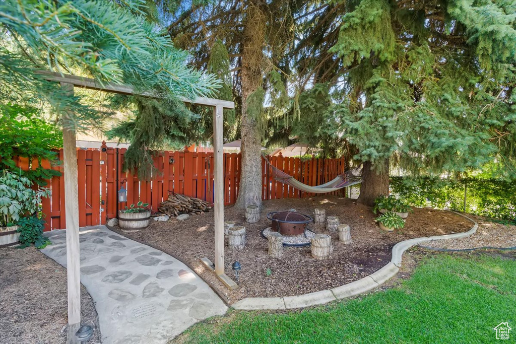 View of yard with an outdoor fire pit