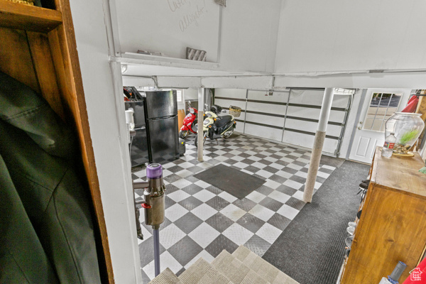 Garage with freestanding refrigerator