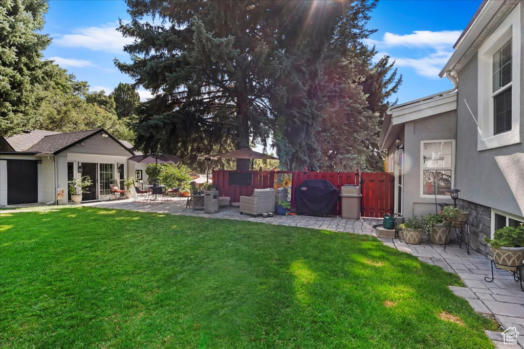 View of yard with a patio area