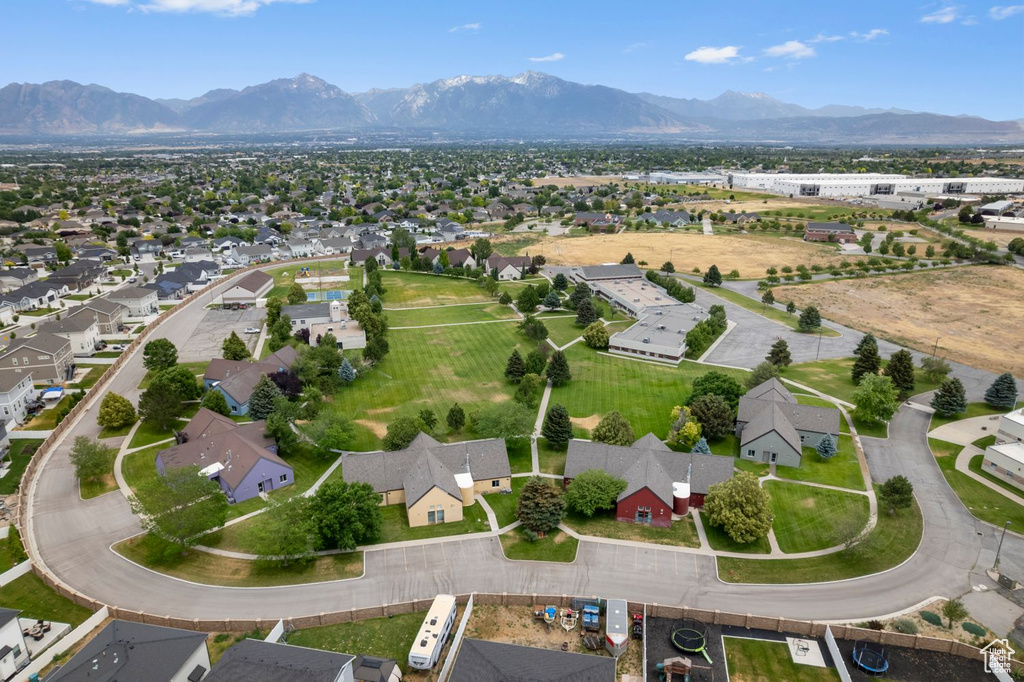Aerial perspective of suburban area featuring a mountain backdrop