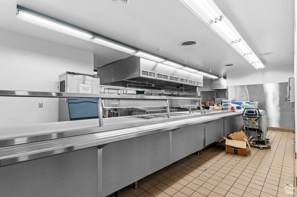 Kitchen featuring stainless steel countertops and tile patterned floors