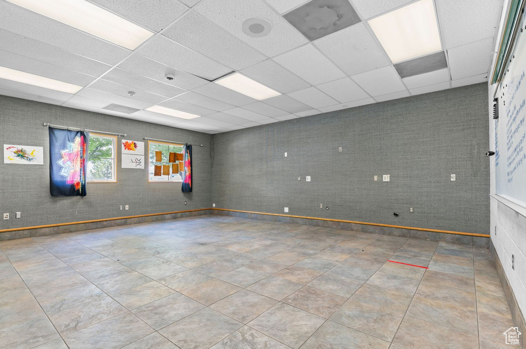 Unfurnished room featuring a paneled ceiling