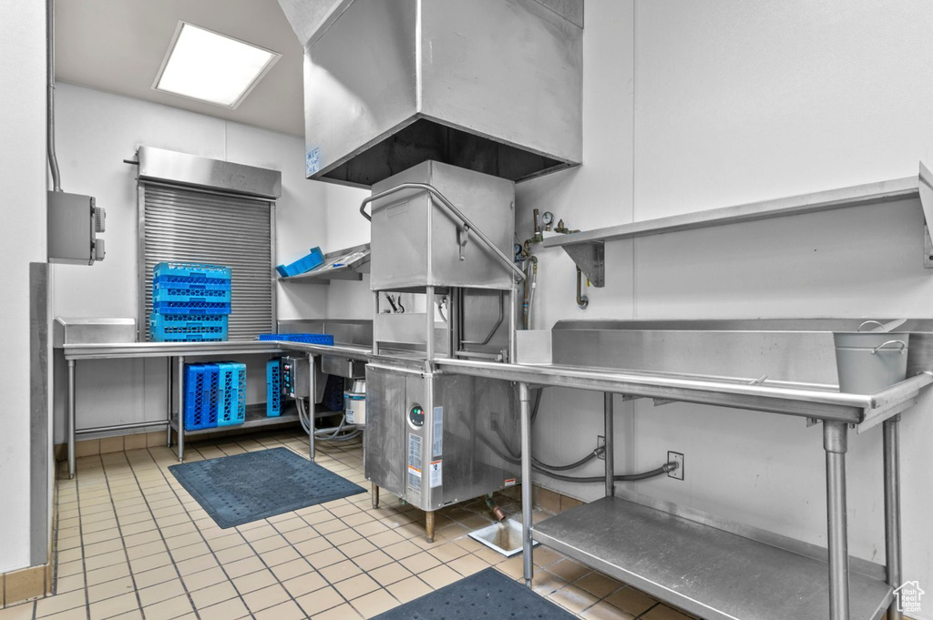 Misc room featuring pet washing station and tile patterned flooring