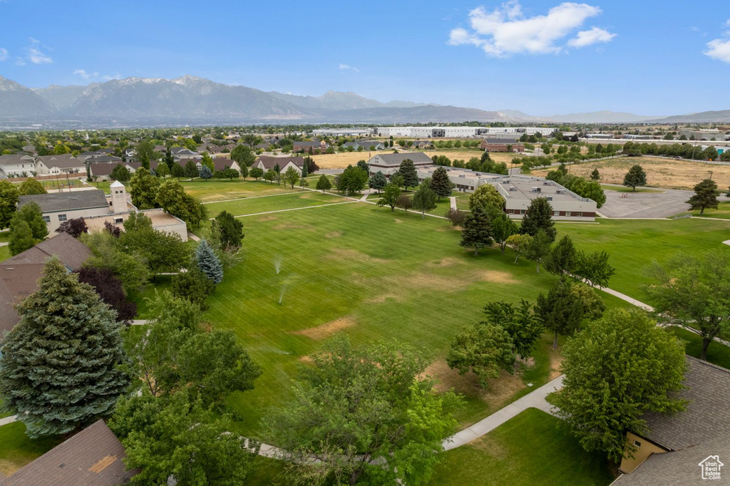 Aerial view of residential area featuring a mountainous background