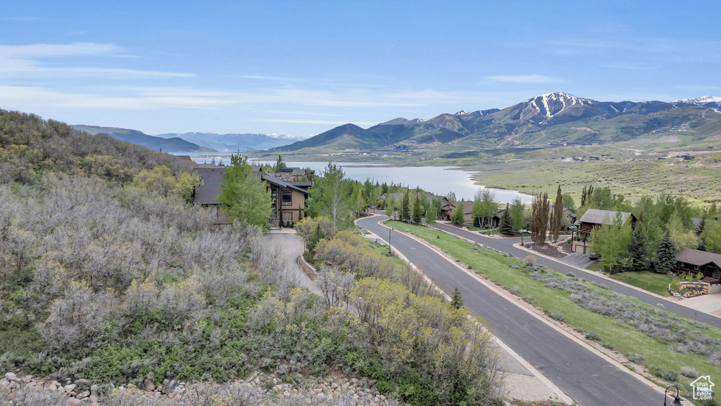 View of mountain backdrop featuring a large body of water
