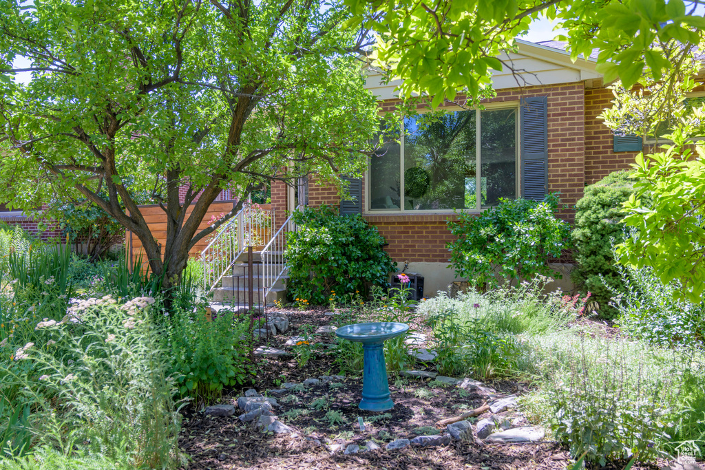 View of side of property featuring brick siding
