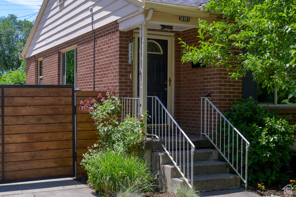Entrance to property with brick siding