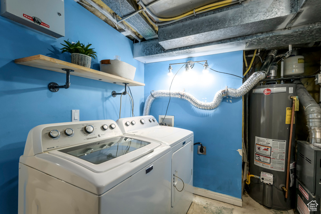 Washroom with gas water heater and separate washer and dryer