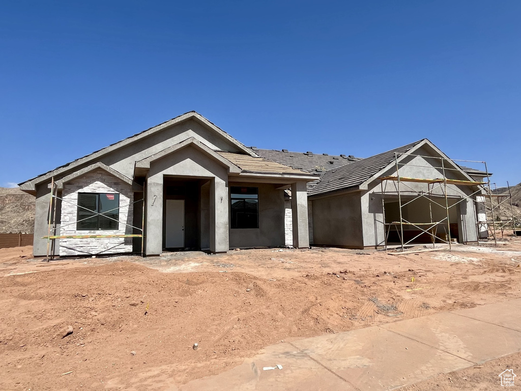 Property in mid-construction with stucco siding