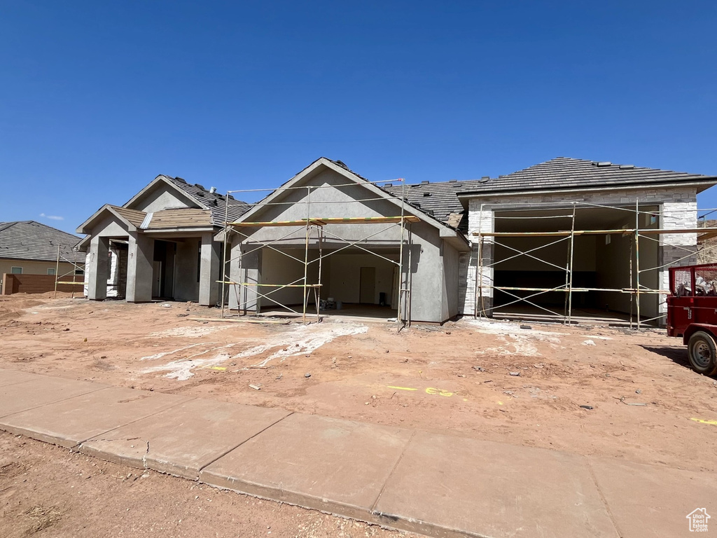 Unfinished property with stucco siding