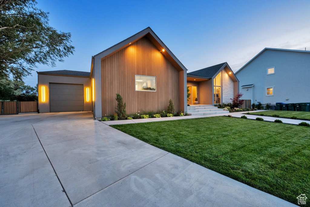 View of front of home featuring driveway and an attached garage