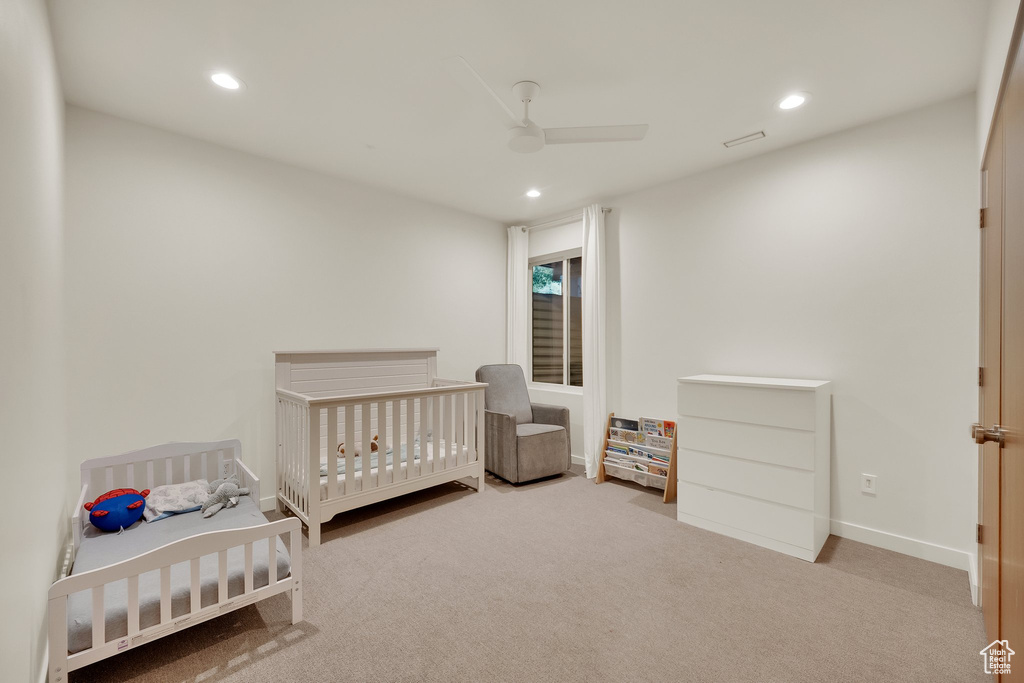 Carpeted bedroom featuring recessed lighting and ceiling fan