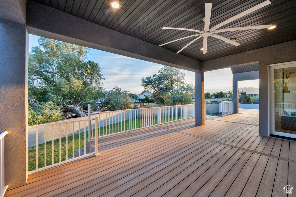 Wooden terrace with a ceiling fan