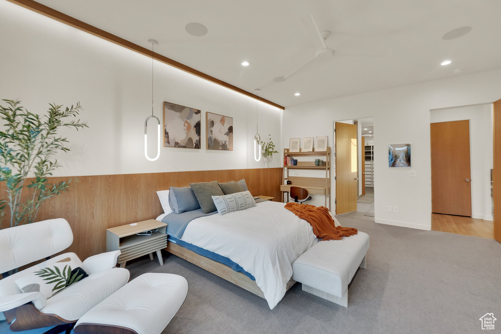 Bedroom with recessed lighting, carpet flooring, and a wainscoted wall