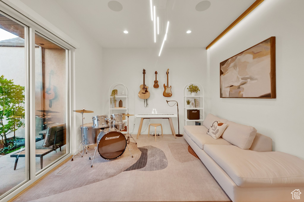 Carpeted living room featuring recessed lighting