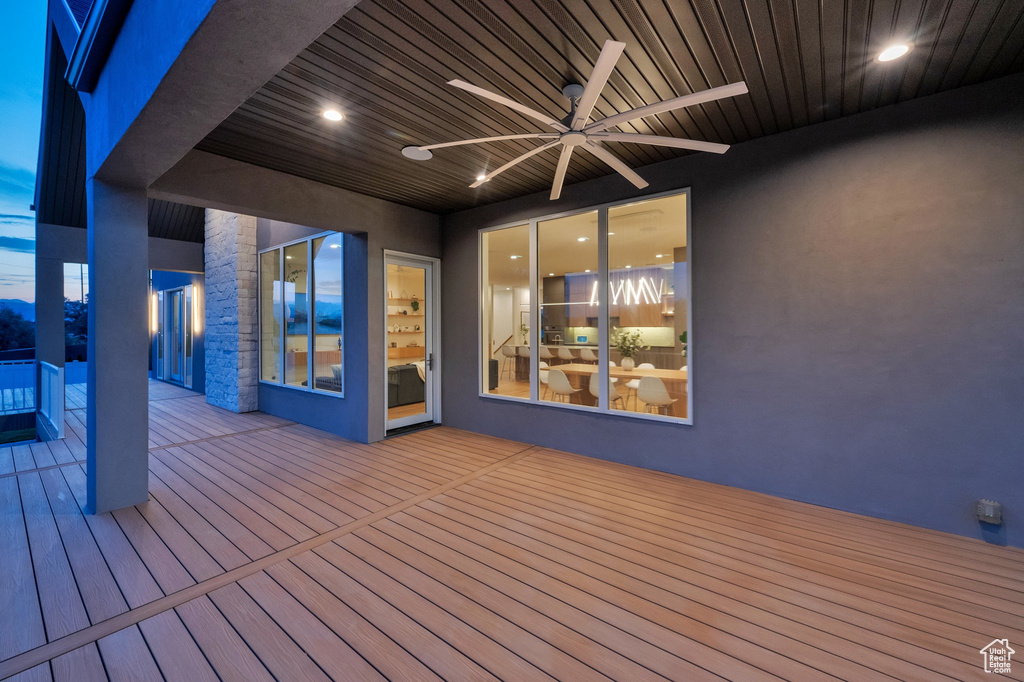 Wooden deck featuring ceiling fan