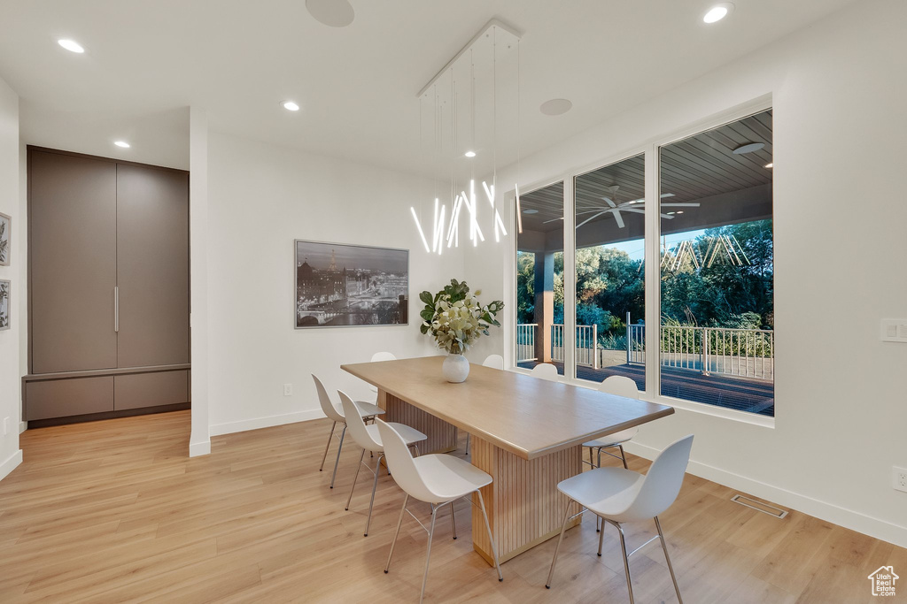 Dining room featuring light wood finished floors and recessed lighting