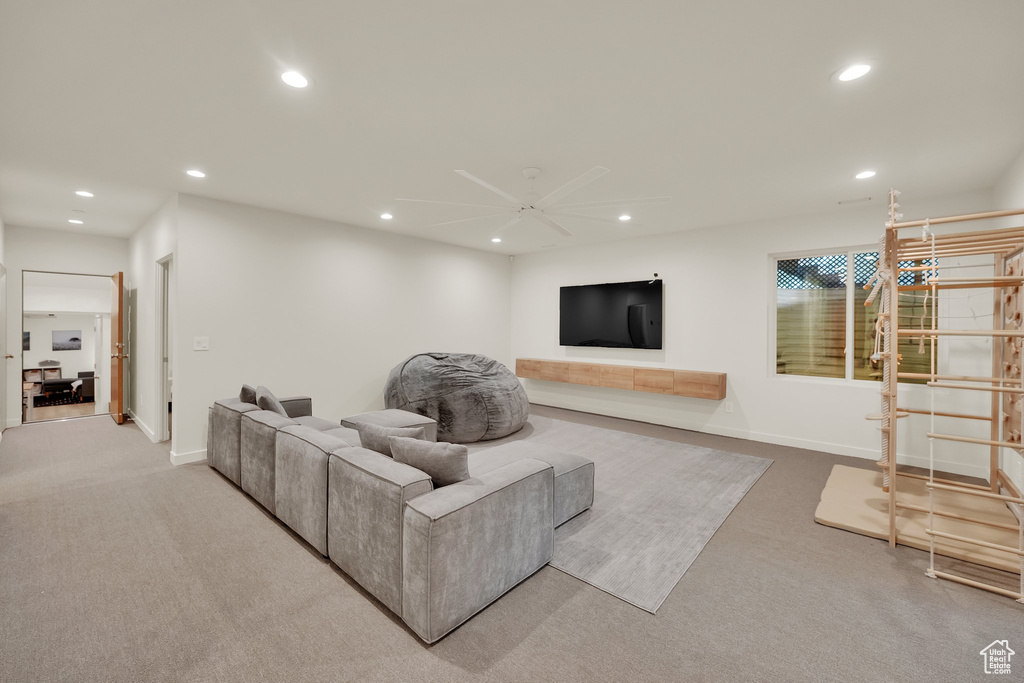 Living room featuring recessed lighting, carpet flooring, and ceiling fan