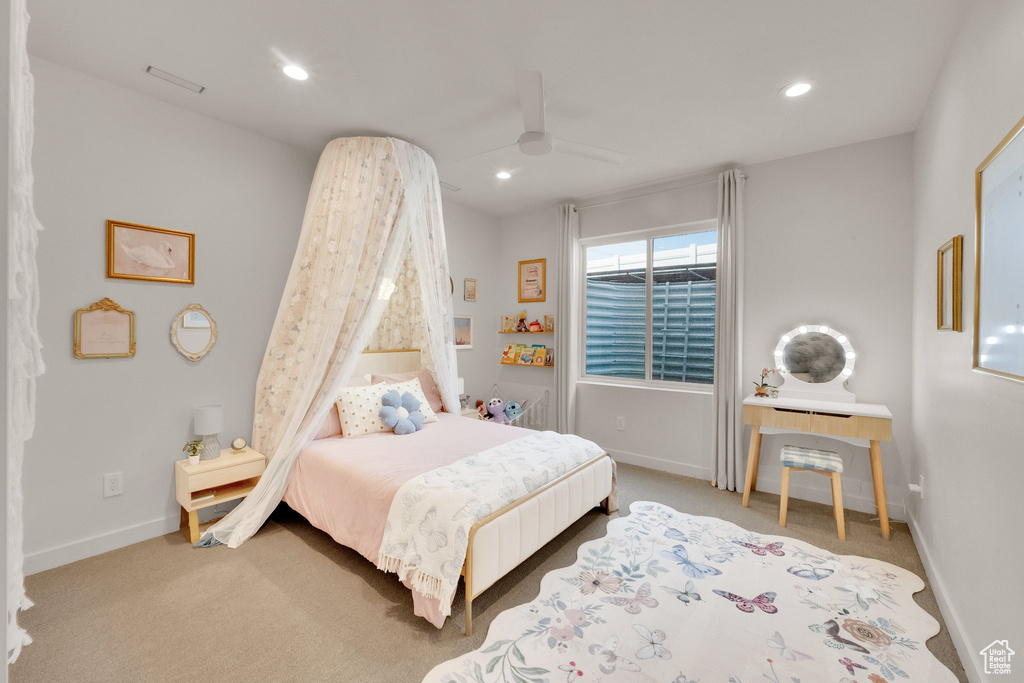 Carpeted bedroom with recessed lighting and ceiling fan
