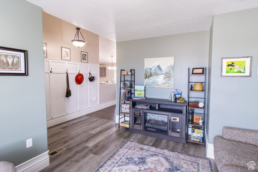 Living area featuring wood finished floors and baseboards