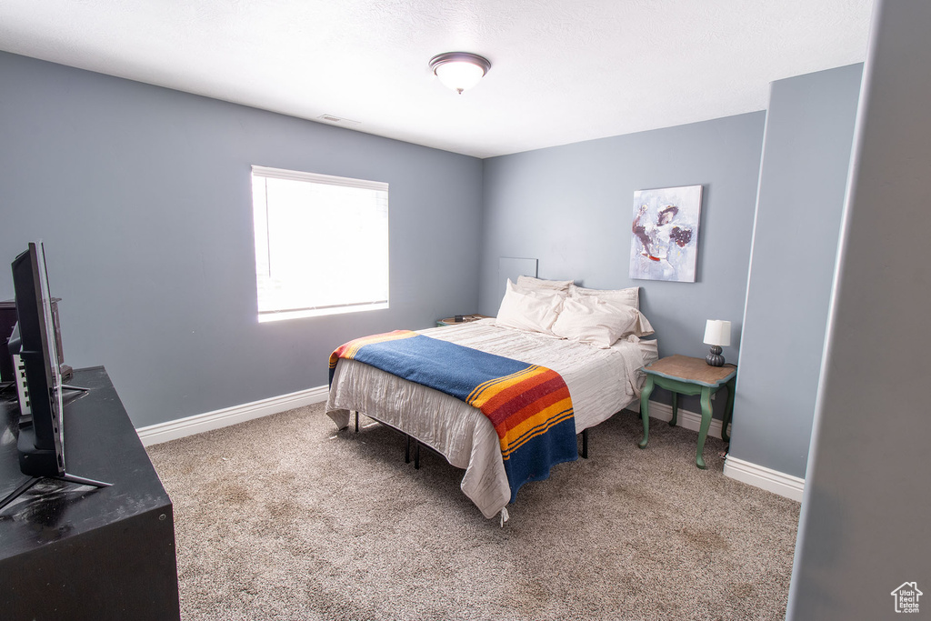 Bedroom featuring carpet