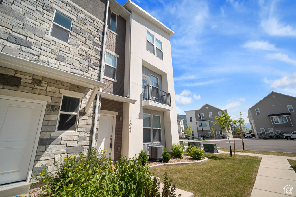 View of property with a residential view