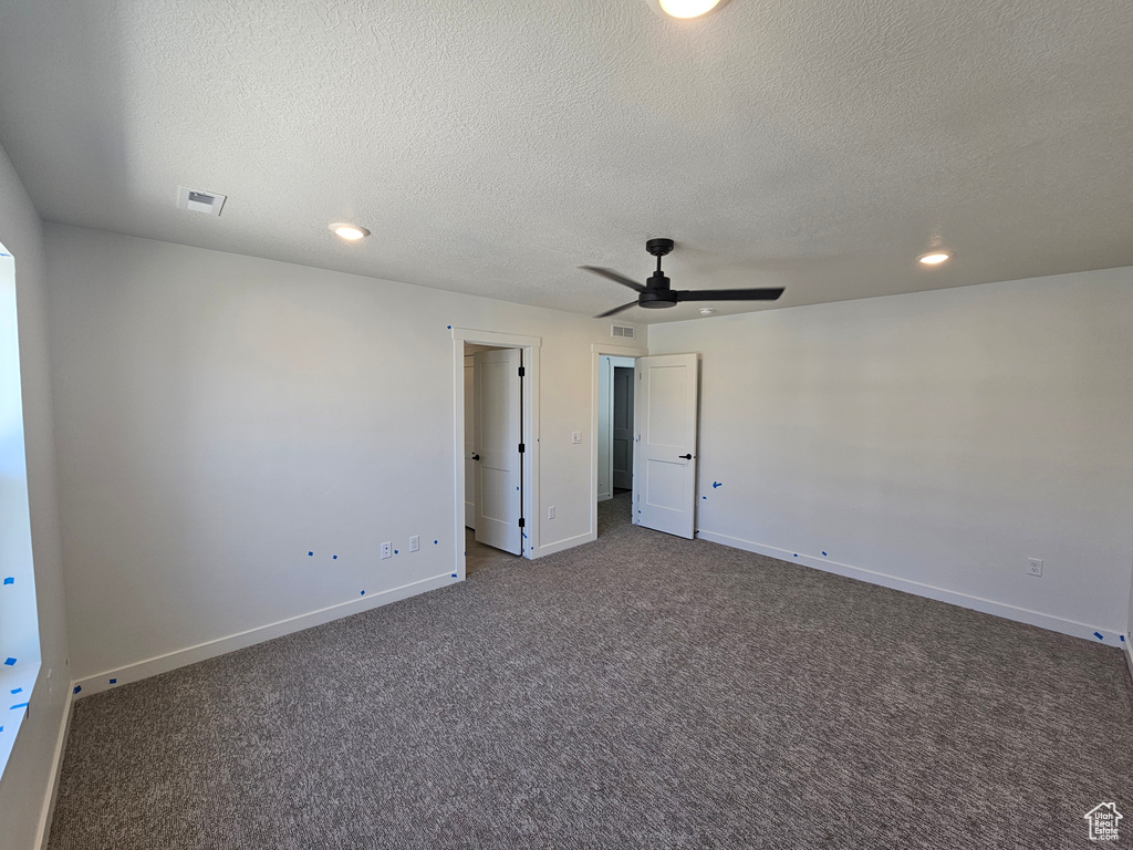 Unfurnished bedroom with carpet, a textured ceiling, recessed lighting, and a ceiling fan