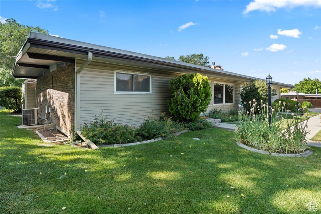 View of home's exterior featuring a yard