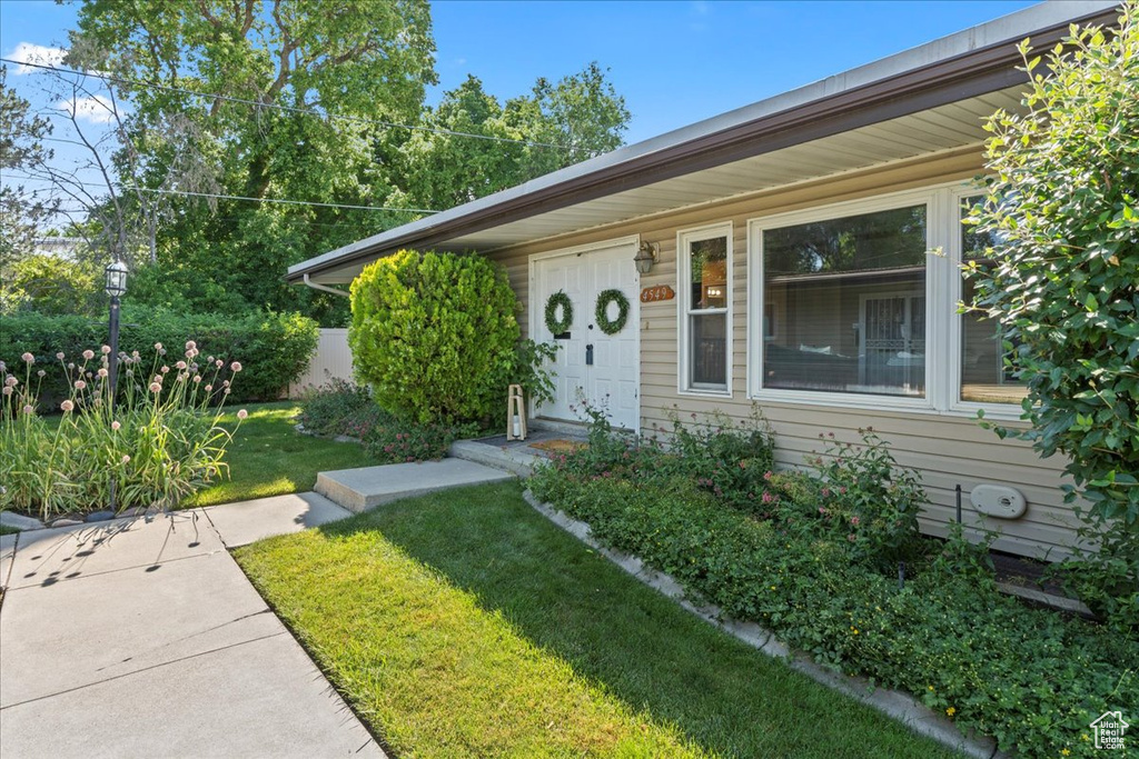 View of front of house with a front lawn