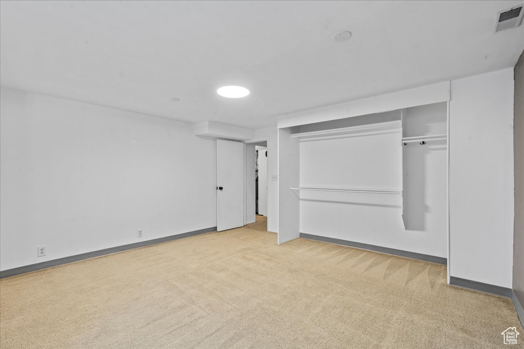 Unfurnished bedroom with carpet floors and a closet