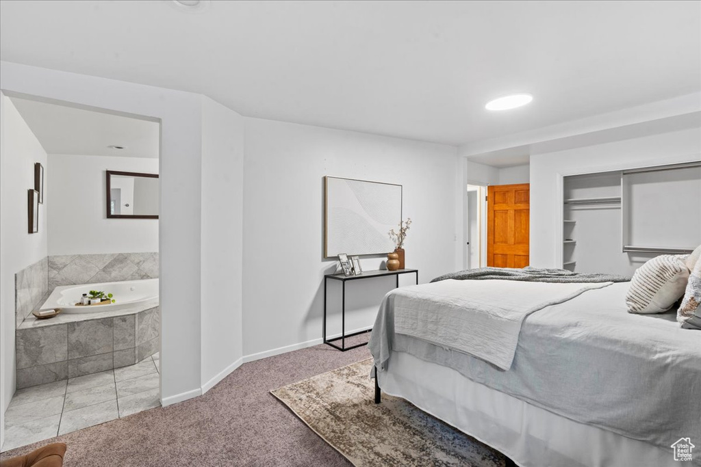 Bedroom featuring carpet floors and a closet