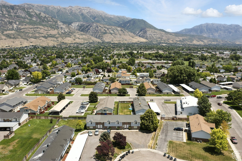 Aerial view of residential area featuring a mountain backdrop