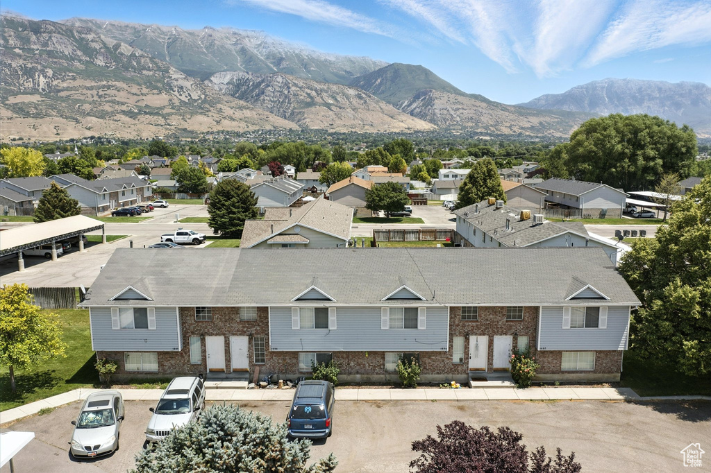Aerial view of residential area with a mountainous background