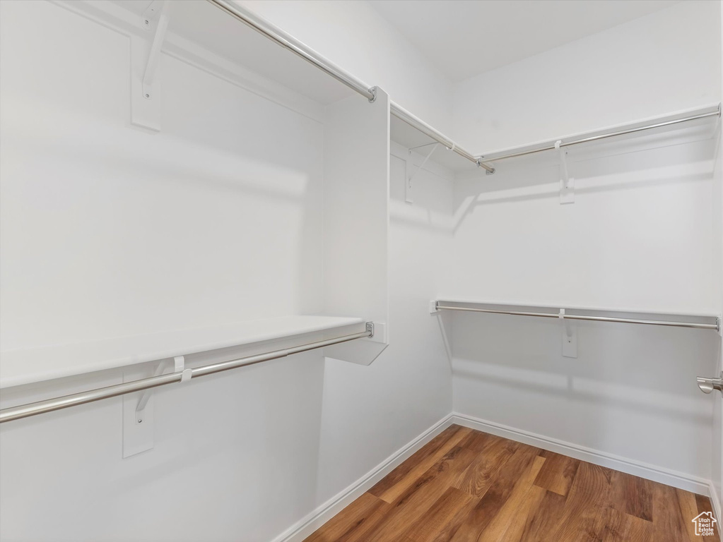 Spacious closet with wood finished floors