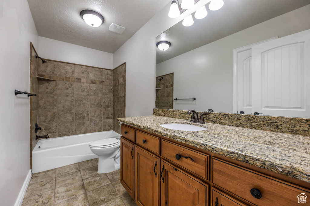 Bathroom featuring vanity and shower / tub combination