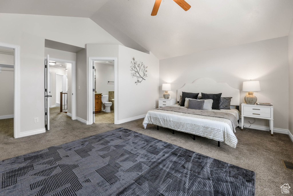 Bedroom featuring carpet, lofted ceiling, ensuite bath, and ceiling fan