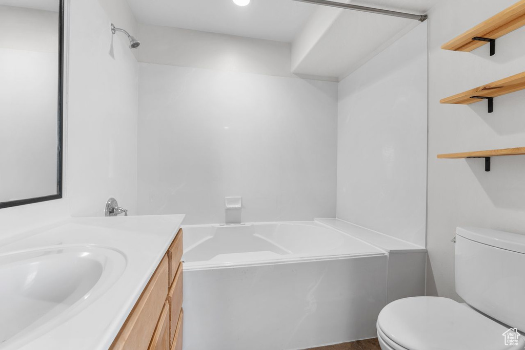 Bathroom with a bath and vanity