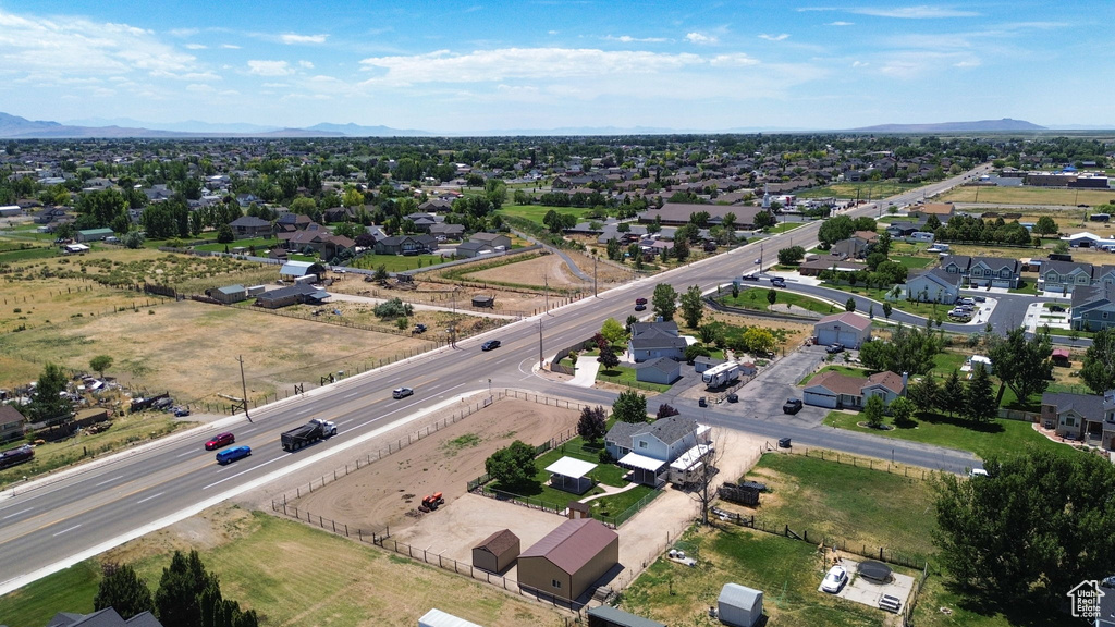 Aerial perspective of suburban area with a mountainous background