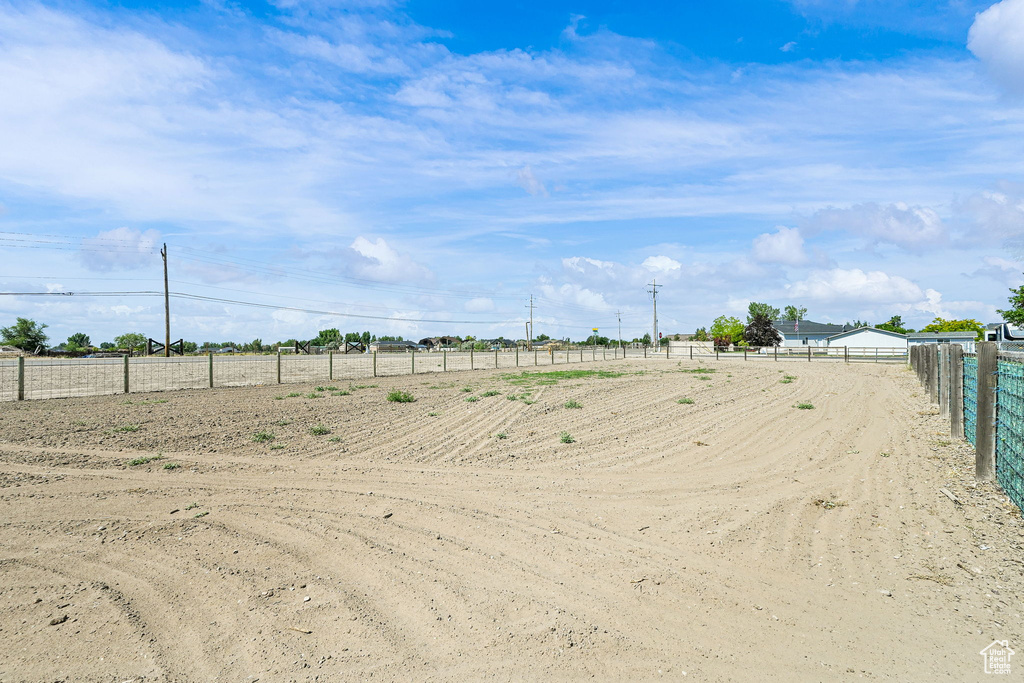 View of yard with an outdoor riding arena and a view of countryside