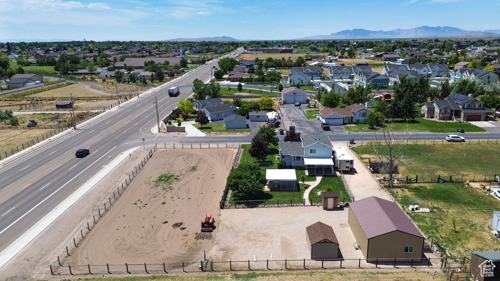 Aerial view of residential area featuring a mountain backdrop