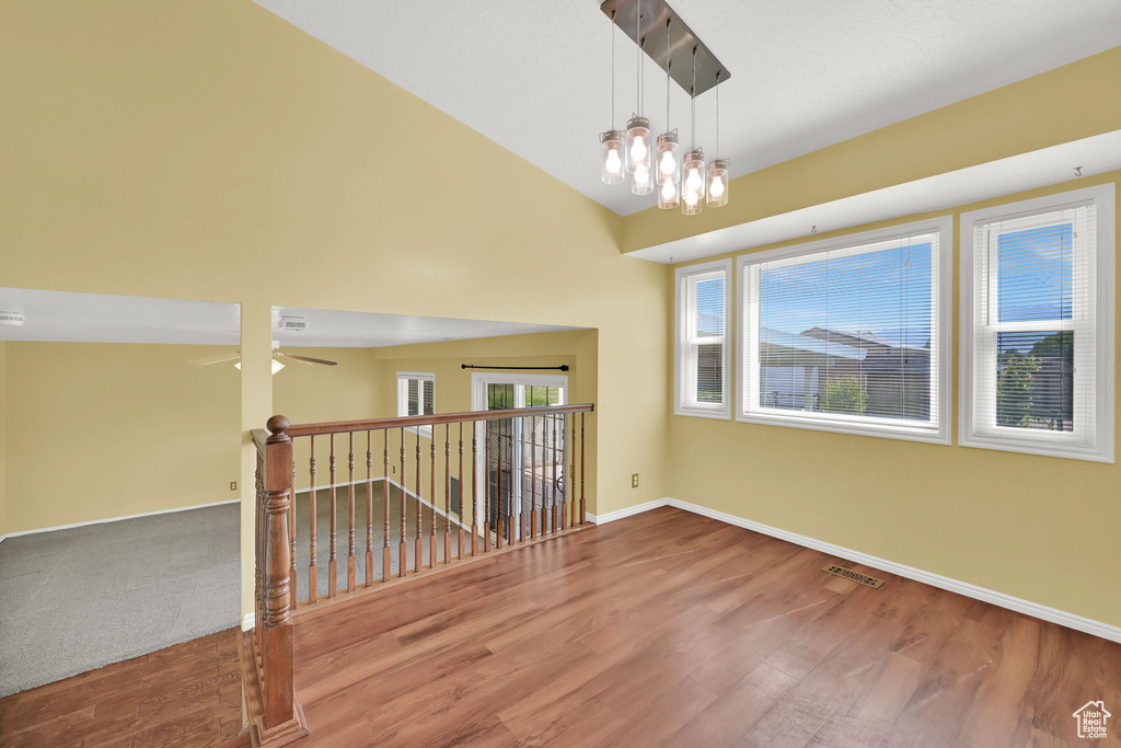 Spare room featuring wood finished floors and a ceiling fan