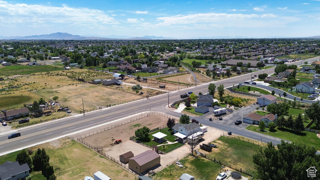 View of property location featuring nearby suburban area and a mountainous background