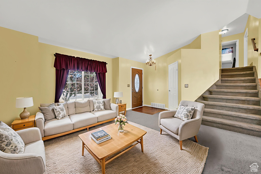 Living room featuring a chandelier and stairway